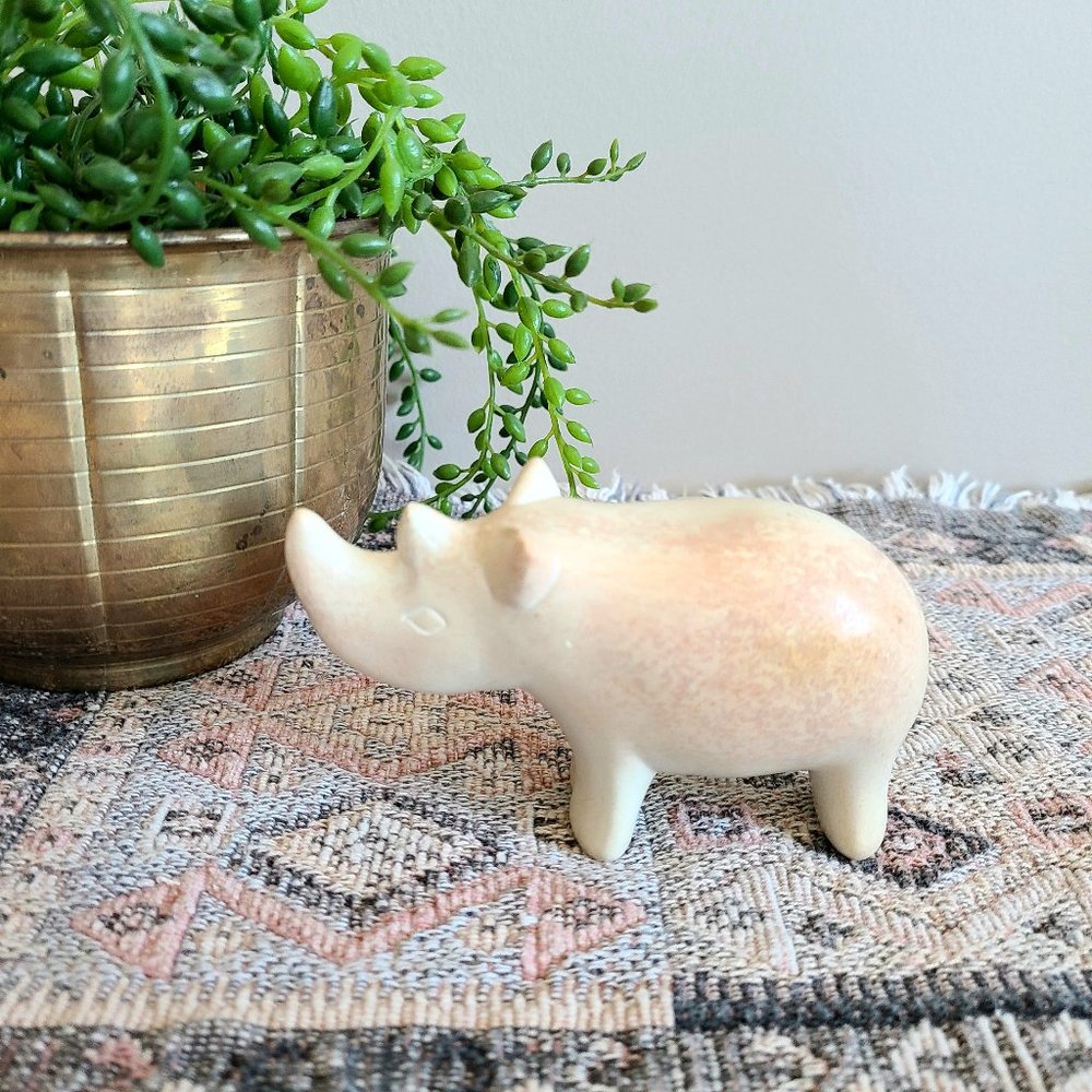 Stone Rhino figurine.